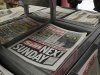 Copies of The Sun newspaper are seen for sale at a newsstand in London