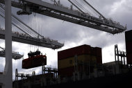 <p> In this March 1, 2013 photo, a crane removes a container from a ship at the Port of Baltimore's Seagirt Marine Terminal in Baltimore. The U.S. trade deficit unexpectedly narrowed in February as exports climbed close to an all-time high and the volume of imported crude oil fell to the lowest level in 17 years, according to information released by the Commerce Department, Friday, April 5, 2013. (AP Photo/Patrick Semansky)