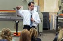 Wisconsin Gov. Scott Walker addresses workers at Technical Metal Specialists Inc. in Milwaukee Friday, March 30, 2012, hours after a state elections board confirmed that a recall election against him will go forward. The Republican governor says he's not worried, and that the election will allow him to once again earn the trust of a majority of Wisconsin voters. (AP Photo/Denish Ramde)