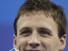 U.S. Ryan Lochte shows the gold medal he won in the men's 200m Backstroke final at the FINA Swimming World Championships in Shanghai, China, Friday, July 29, 2011. (AP Photo/Michael Sohn)