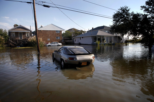 A Porsche sits in flood waters from Hurricane Irene on Willoughby Spit, Sunday, Aug. 28, 2011 in Norfolk, Va.,  (AP Photo/The Virginian-Pilot, Preston Gannaway) MAGS OUT