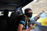 Syrian rebels hunt for snipers after attacking the municipality building in the city center of Selehattin, near Aleppo, during fights between rebels and Syrian troops. Syria admitted on Monday it has chemical weapons and warned of using them if attacked, though not against its own civilians, as regime troops reclaimed most of Damascus after a week of heavy clashes