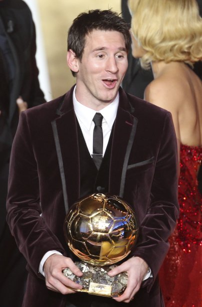 Argentina's Lionel Messi reacts after he was awarded the prize for the soccer of the year 2011 at the FIFA Ballon d'Or awarding ceremony in Zurich, Switzerland, Monday, Jan. 9, 2012. (AP Photo/Michael Probst)
