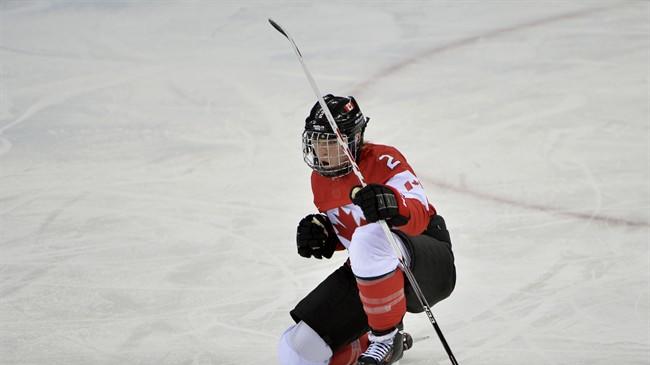 Canada's Meghan Agosta-Marciano celebrates her goal against Finland during third period action at the Sochi Winter Olympics Monday February 10, 2014 in Sochi, Russia. Canada defeated Finland 3-0.THE CANADIAN PRESS/Adrian Wyld