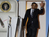 President Barack Obama waves as he exits Air Force One at Andrews Air Force Base, Md., Tuesday, Oct. 11, 2011. (AP Photo/Cliff Owen)