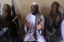 A screengrab taken from a video released on You Tube on April 12 apparently shows Boko Haram leader Abubakar Shekau (C)