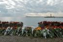 Flowers in memory of passengers and crew members of Russian military Tu-154, which crashed into the Black Sea on its way to Syria on Sunday, are placed at an embankment in the Black Sea resort city of Sochi