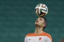Netherlands' Robin van Persie controls the ball during an official training session the day before the group B World Cup soccer match between Spain and the Netherlands at the Arena Ponte Nova in Salvador, Brazil, Thursday, June 12, 2014. (AP Photo/Natacha Pisarenko)