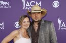 Jason Aldean, left, and Jessica Aldean arrive at the 47th Annual Academy of Country Music Awards on Sunday, April 1, 2012 in Las Vegas. (AP Photo/Isaac Brekken)