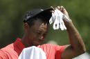 Tiger Woods wipes his face before hitting from the 16 tee during the final round of The Players Championship golf tournament, Sunday, May 10, 2015, in Ponte Vedra Beach, Fla. (AP Photo/Lynne Sladky)