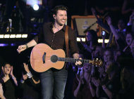 FILE - In this Nov. 9, 2011 file photo, Chris Young performs "Voices" during the 45th Annual CMA Awards in Nashville, Tenn. Young hosted the CMA Keep the Music Playing All Stars Concert at the Schermerhorn Symphony Center Tuesday, Jan. 31, 2012, in Nashville, where the Country Music Association announced a $1.4 million donation to music education in metro Nashville public schools. (AP Photo/Mark Humphrey, file)