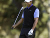 Tiger Woods reacts after hitting from the 18th fairway at Spyglass Hill Golf Course during the first round of the Pebble Beach National Pro-Am golf tournament in Pebble Beach, Calif., Thursday, Feb. 9, 2012. (AP Photo/Marcio Jose Sanchez)