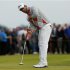 Adam Scott of Australia watches his putt on the 14th green during the third round of the British Open golf championship at Royal Lytham & St Annes