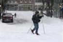 Jason Gallant snowshoes to work after a snowstorm in Portland, Maine