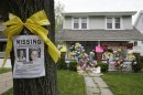 FILE - In this Wednesday, May 8, 2013 file photo, a missing poster still rests on a tree outside the home of Amanda Berry, in Cleveland. For Berry, Gina DeJesus and Michelle Knight, who were freed from captivity inside a Cleveland house earlier this week, the ordeal is not over. Next comes recovery _ from sexual abuse and their sudden, jarring reentry into a world much different than the one they were snatched from a decade ago. (AP Photo/Tony Dejak, File)