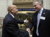 Former New York Stock Exchange Chairman Richard Grasso, left, is greeted by current NYSE CEO Duncan Niederauer as Grasso arrives at the exchange Friday, Sept. 9, 2011. Grasso is participating the exchange's Sept. 11 commemoration. (AP Photo/Richard Drew)