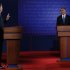 Republican presidential nominee Romney speaks as U.S. President Obama listens during the first presidential debate in Denver