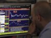 Trader looks at his screen on Unicredit Bank trading floor in downtown Milan