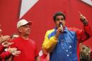 Venezuela's President Maduro speaks next to retired General Carvajal as they attends the Socialist party congress in Caracas