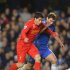 Chelsea's Ivanovic challenges Liverpool's Suarez during their English Premier League soccer match at Stamford Bridge Stadium in London