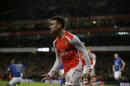 Arsenal's Laurent Koscielny celebrates scoring his side's first goal during the English Premier League soccer match between Arsenal and Leicester City at the Emirates Stadium in London, Tuesday, Feb. 10, 2015. (AP Photo/Matt Dunham)