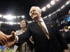 FILE - This Jan. 1, 2012 file photo shows New Orleans Saints owner Tom Benson and his wife Gayle Benson shaking hands before an NFL football game against the Carolina Panthers in New Orleans. A person familiar with the deal says the NBA has agreed to sell the New Orleans Hornets to Saints owner Tom Benson for $338 million. The person spoke to The Associated Press Friday, April 13, 2012,  on condition of anonymity because the deal has not been announced. (AP Photo/Bill Haber, File)
