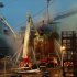 In this video image from Ru-RTR Russian state television channel, firefighters spray water on the Yekaterinburg nuclear submarine in a dock at the Roslyakovo shipyard in the Murmansk region, Russia, Friday, Dec. 30, 2011. A fire that erupted while the Yekaterinburg was in drydock for repairs at the town of Roslyakovo near Murmansk has left seven crewmembers injured after they inhaled poisonous fumes from the blaze. (AP Photo/Ru-RTR Russian state channel/ Via APTN)