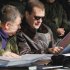 Russian President Dmitry Medvedev and Defense Minister Anatoly Serdyukov, left, look at maps during Center-2011 military maneuvers in the Chelyabinsk region of Russia on Tuesday, Sept. 27, 2011. (AP photo/ RIA Novosti, Dmitry Astakhov, Presidential Press Service)