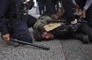 Occupy Wall Street movement activist Jeremy Deheart is arrested by police during a march through downtown Manhattan, New York