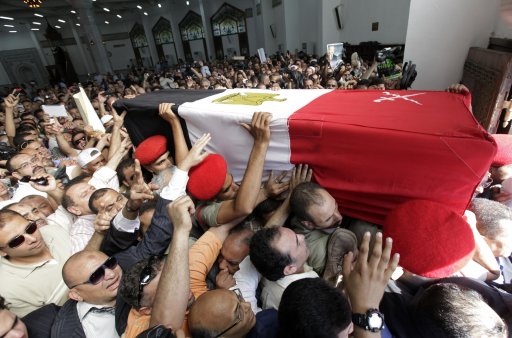 People attend the funeral of Egypt's former intelligence chief Suleiman in Cairo
