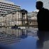 A man walks in front of the Bank of Japan headquarters building in Tokyo