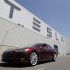 A Tesla Model S drives outside the Tesla factory in Fremont, Calif., Friday, June 22, 2012. The first Model S sedan car will be rolling off the assembly line on Friday.  (AP Photo/Paul Sakuma)