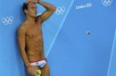 Britain's Tom Daley rests in between dives in the men's synchronised 10m platform final during the London 2012 Olympic Games at the Aquatics Centre