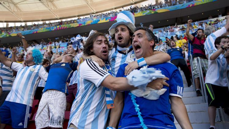 Argentina soccer fans celebrate their team&#39;s World Cup quarterfinal victory over Belgium at the Estadio Nacional, in Brasilia, Brazil Saturday, July 5, 2014. Gonzalo Higuain&#39;s first goal of this World Cup sent Argentina into the semifinals on Saturday with a 1-0 win over Belgium