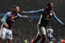 Aston Villa's Leandro Bacuna, right, celebrates scoring the second goal, during the English Premier League match against West Bromwich Albion, at Villa Park, Birmingham, England, Wednesday Jan. 29, 2014. (AP Photo/PA, Nick Potts) UNITED KINGDOM OUT