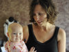 In this Sept. 29, 2011 photo, Kandace O'Neill poses with her 7-month-old daughter, in Lakeville, Minn. O'Neill's views on child vaccinations are shared by many parents who don't follow federal vaccine advice. Her 5-year-old son has had no vaccinations since he turned 1 and the baby girl has received none of the recommended shots.  (AP Photo/Jim Mone)