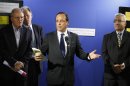 French President Francois Hollande, center, delivers his speech as he visits the Secours Catholique charity organisation center in Colombes, West of Paris, Friday July 13, 2012.(AP Photo/Pool/Remy de la Mauviniere)