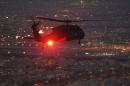 A UH-60 Blackhawk helicopter from Bravo Co 2/147th AVN Renegades flies support for U.S. Defense Secretary Hagel over Kuwait City