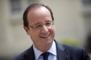 France's President Francois Hollande reacts during a visit of the Elysee Palace in Paris