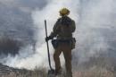 Firefighters battle the so-called Blue Cut Fire in San Bernardino County