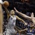 San Antonio Spurs' Tony Parker (9), of France, goes up for a shot against the Memphis Grizzlies defense during the first half in Game 2 of the Western Conference finals NBA basketball playoff series, Tuesday, May 21, 2013, in San Antonio. (AP Photo/Eric Gay)
