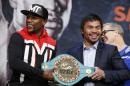 Boxers Floyd Mayweather Jr., left, and Manny Pacquiao pose with a WBC belt during a press conference Wednesday, April 29, 2015, in Las Vegas. Mayweather will face Pacquiao in a welterweight title fight in Las Vegas on May 2. (AP Photo/John Locher)