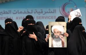 Saudi Shiite women hold placards bearing portraits &hellip;