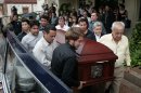 Chilean Consul in Venezuela, Fernando Berendique, right front, helps to carry the coffin with the remains of his 19-year-old daughter Karen to a waiting hearse, in Maracaibo, Venezuela, Saturday March 17, 2012. Berendique said his daughter was shot early Saturday, while riding in a vehicle with her brother and another young man, when the trio ignored a command to stop by police at a checkpoint, fearing the officers might be robbers. The Prosecutor General's Office says in a statement that 11 police officers are under investigation for their roles in the death. Berendique's daughter is reported to have died after suffering three bullet wounds. (AP Photo/Fabiola Portillo)
