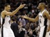 San Antonio Spurs' Danny Green, left, reacts with Gary Neal after scoring during the first half at Game 3 of the NBA Finals basketball series against the Miami Heat, Tuesday, June 11, 2013, in San Antonio. (AP Photo/Eric Gay)