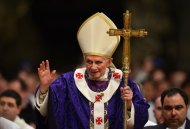 Pope Benedict XVI waves as he leaves after Ash Wednesday mass at St Peter's basilica at the Vatican. Pope Benedict XVI promised top Vatican officials he would remain in "spiritual proximity" with them even after he resigns next week, at the end of a week-long spiritual retreat in the Vatican