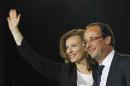 FILE - This Sunday May 6, 2012 file photo shows French president-elect Francois Hollande and his companion Valerie Trierweiler celebrating his election victory in Bastille Square in Paris, France. A French news agency has reported that President Francois Hollande has ended his relationship with his companion of seven years Valerie Trierweiler. (AP Photo/Francois Mori, File)