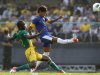 Brazil's Neymar and South Africa's Gaxa fight for the ball during their international friendly soccer match in Sao Paulo