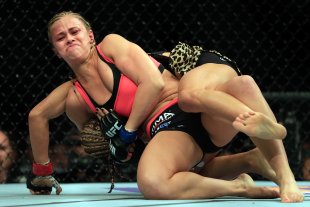 Felice Herrig and Paige VanZant grapple during their UFC strawweight bout at UFC on Fox 15. (Getty)