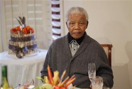 Former South African president Nelson Mandela looks on as he celebrates his birthday at his house in Qunu, Eastern Cape July 18, 2012. REUTERS/Siphiwe Sibeko